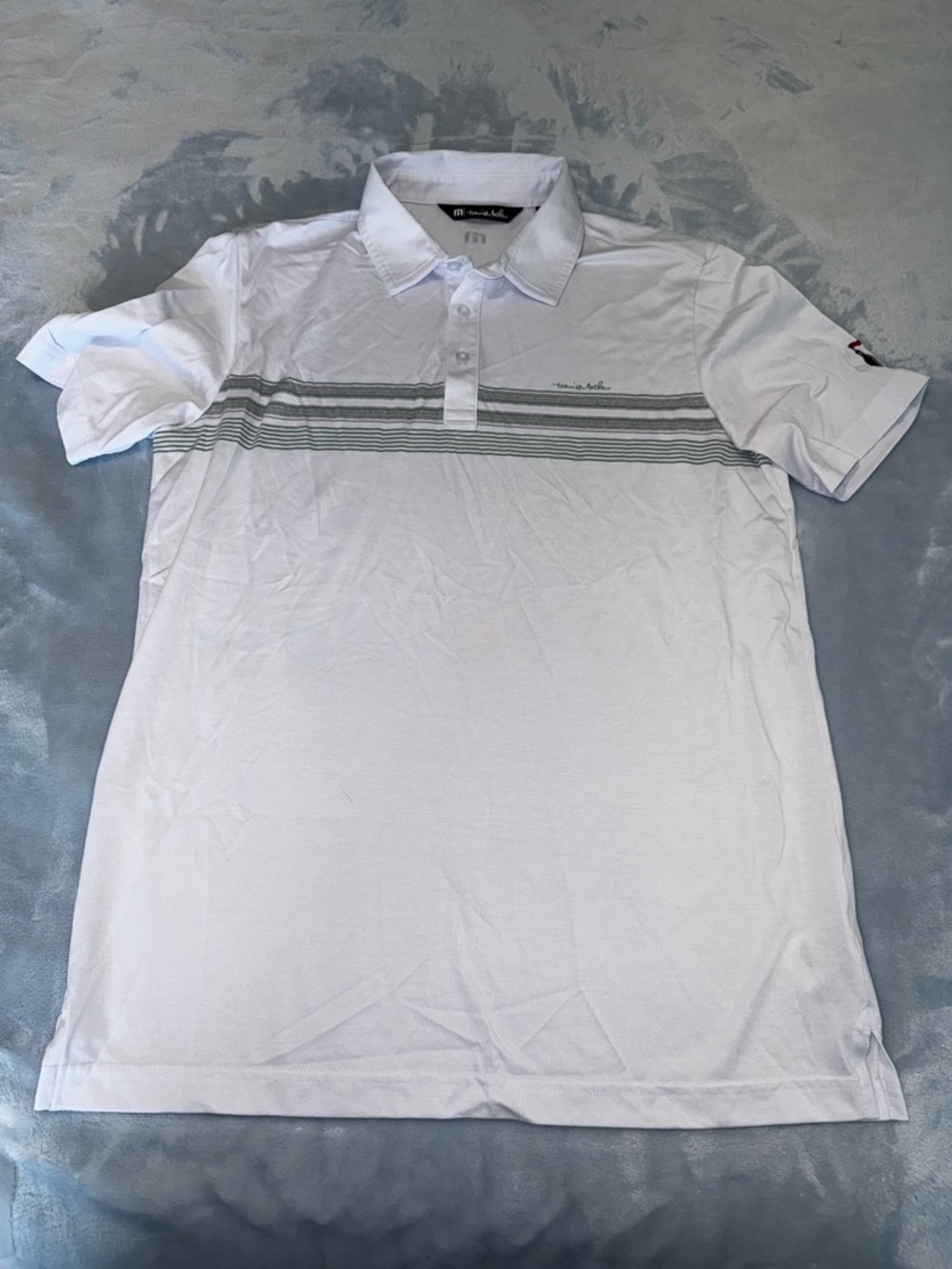Travis Mathew White Polo with Gray-Green Chest Stripes